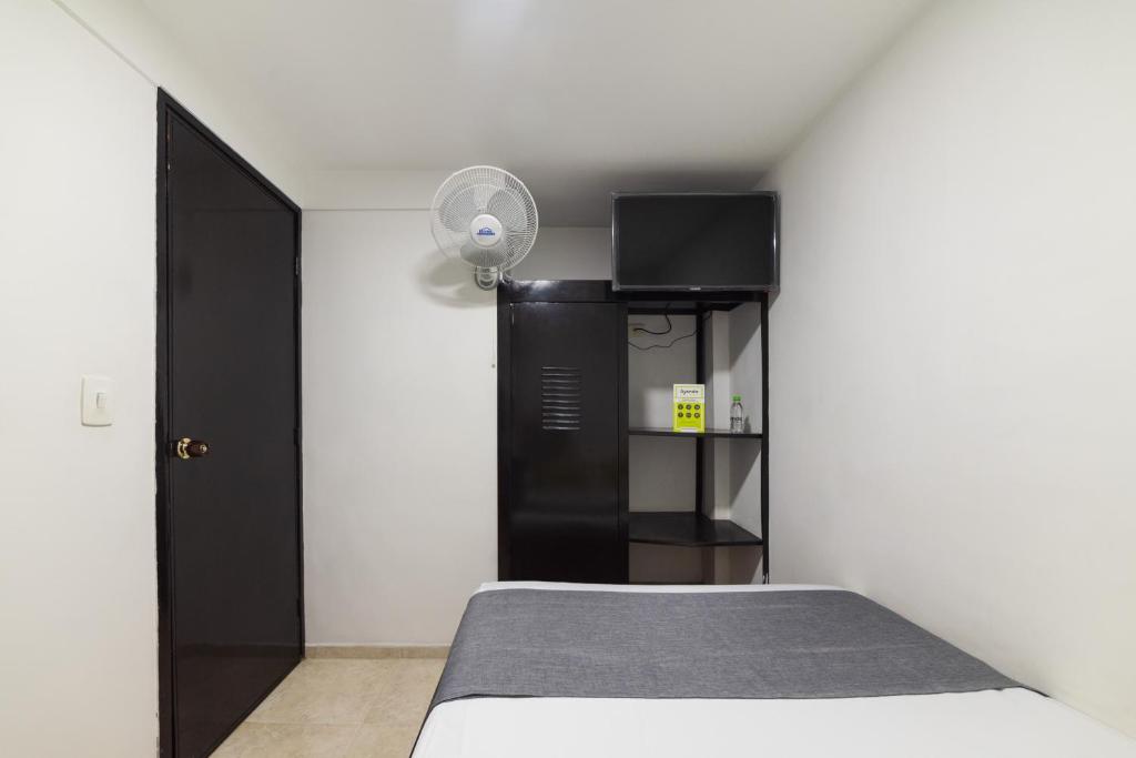 Postel nebo postele na pokoji v ubytování Ayenda 1122 Victoria