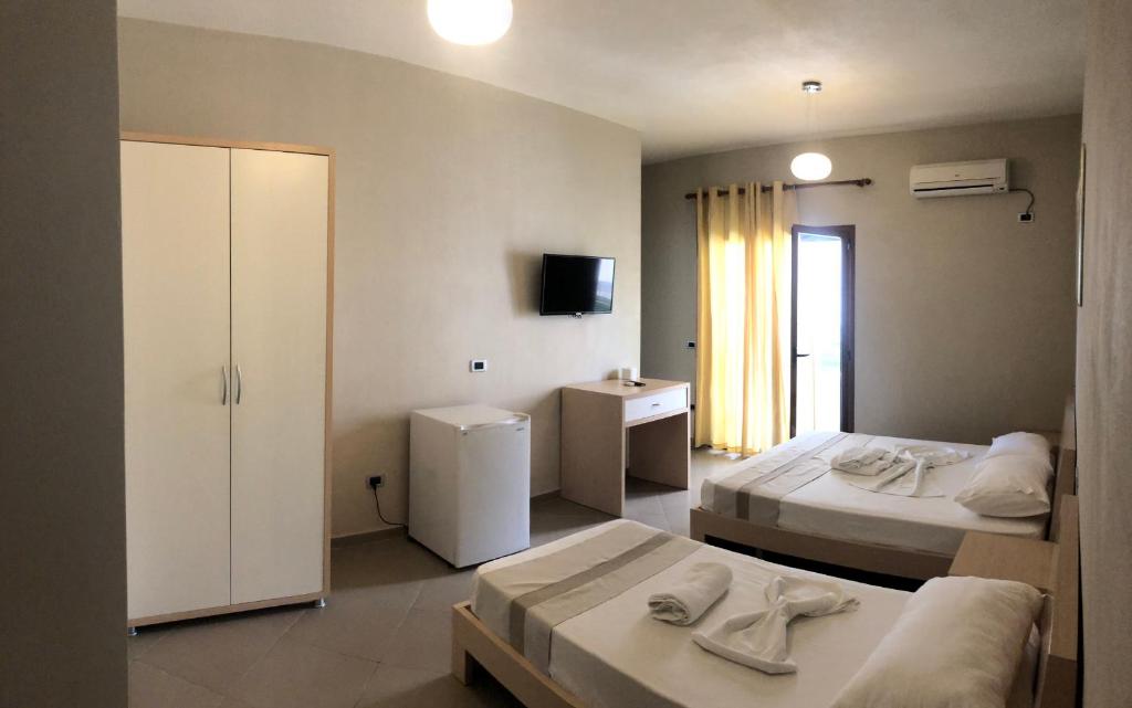 Postel nebo postele na pokoji v ubytování Hotel Denta