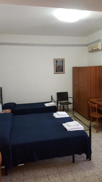 Postel nebo postele na pokoji v ubytování Albergo Pensione Ardenza SELF CHECK-IN
