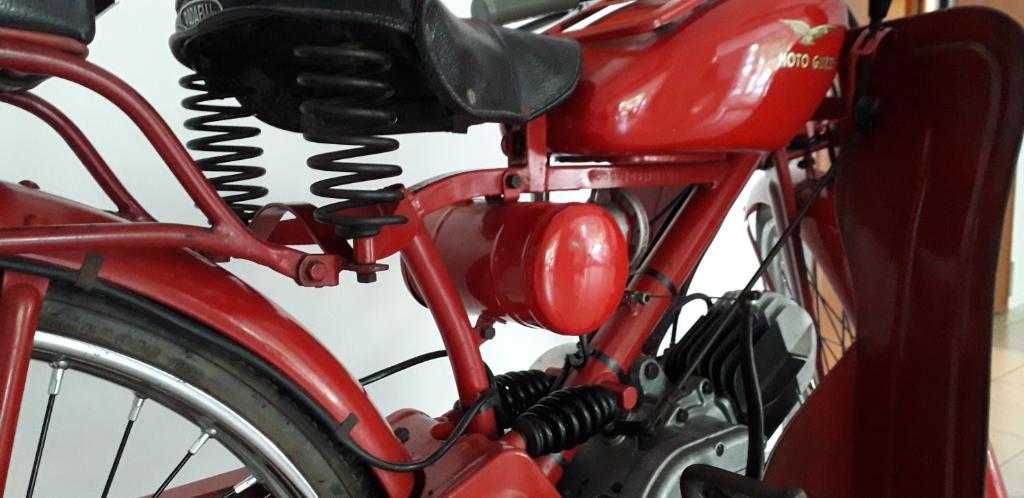 a close up of the front of a red bike at Residence Cigno in Rimini