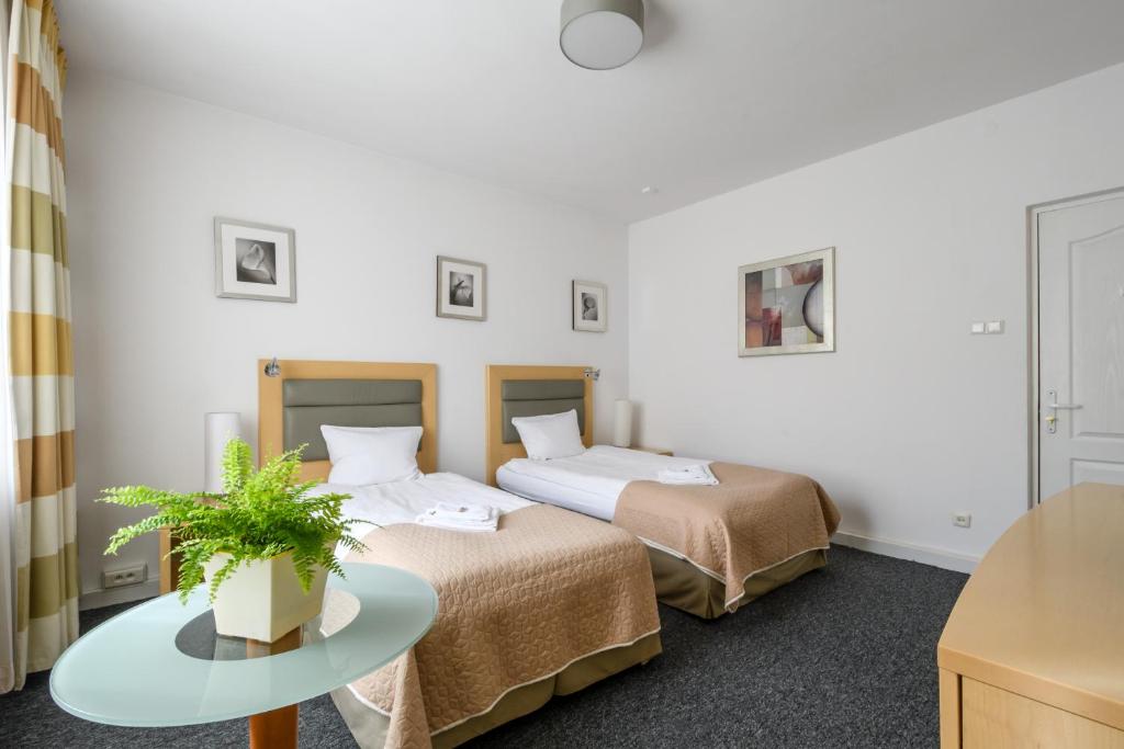 Posteľ alebo postele v izbe v ubytovaní 404 Rooms Wilanowska