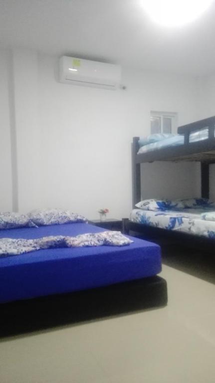 Postel nebo postele na pokoji v ubytování La Roca Coveñas Apartamentos