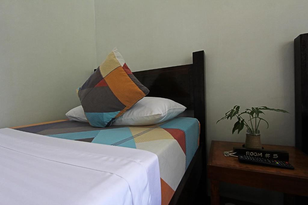 Postel nebo postele na pokoji v ubytování Seaslugs Travellers Inn
