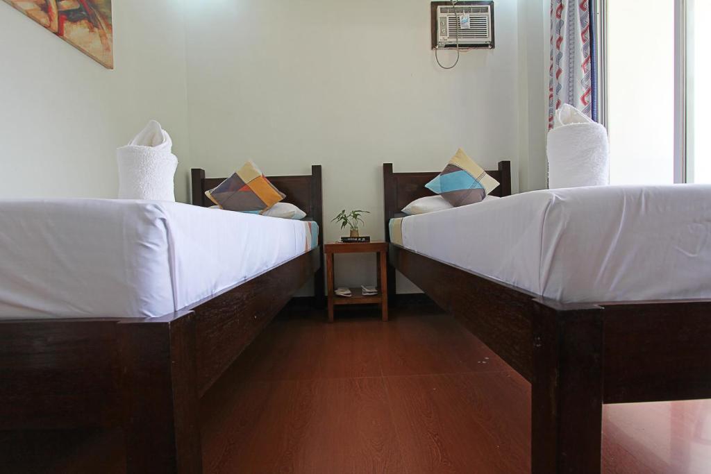 Postel nebo postele na pokoji v ubytování Seaslugs Travellers Inn