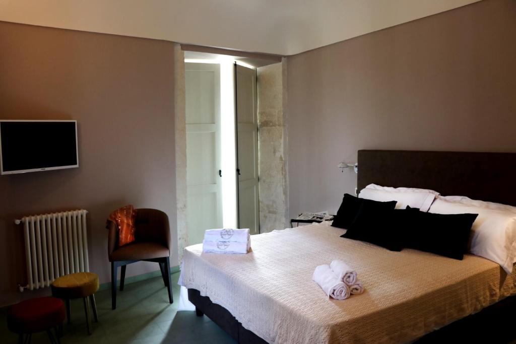 Postel nebo postele na pokoji v ubytování Casa dei Giurati
