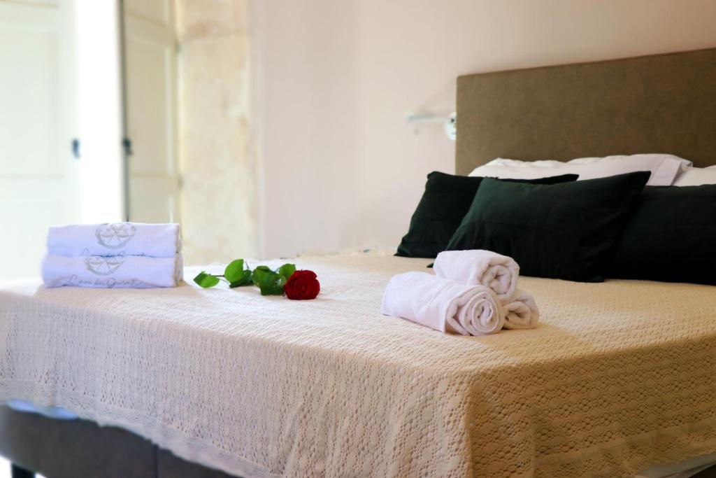 Postel nebo postele na pokoji v ubytování Casa dei Giurati