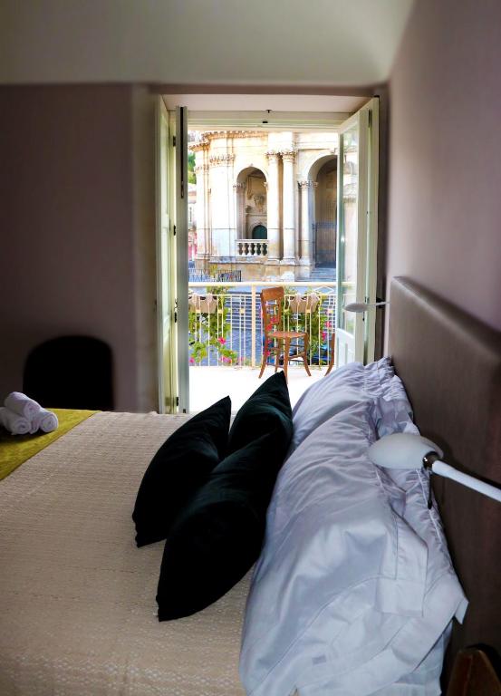 Postel nebo postele na pokoji v ubytování Casa dei Giurati