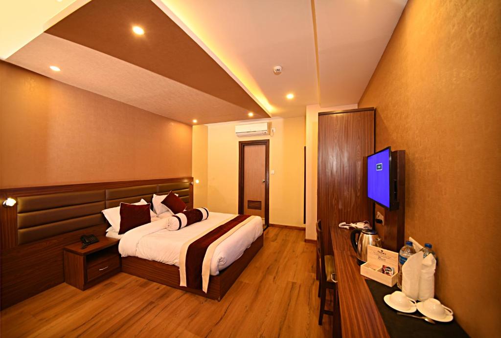 Letto o letti in una camera di The Address Kathmandu Hotel