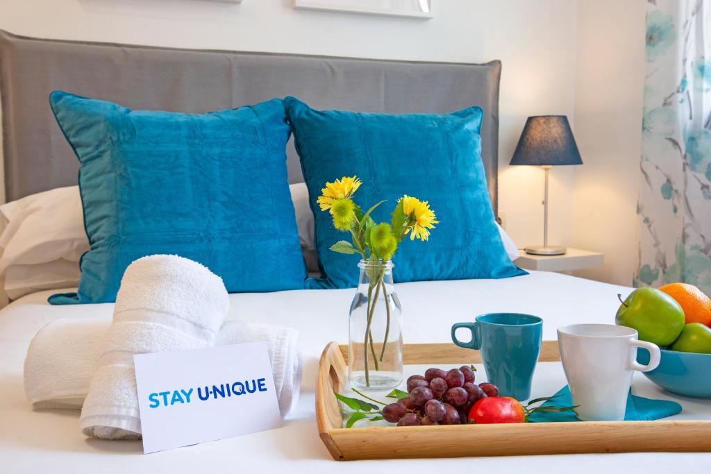 Posteľ alebo postele v izbe v ubytovaní Stay U-nique Apartments Ricart