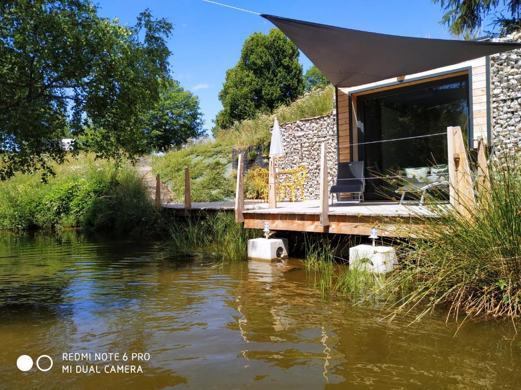 a cabin in the middle of a river at Re(s)source in Le Chambon-sur-Lignon