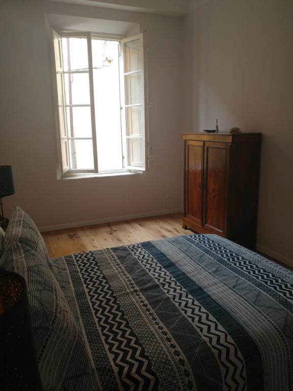 A bed or beds in a room at The SPIRIT OF LUCCA with all comfortable amenities