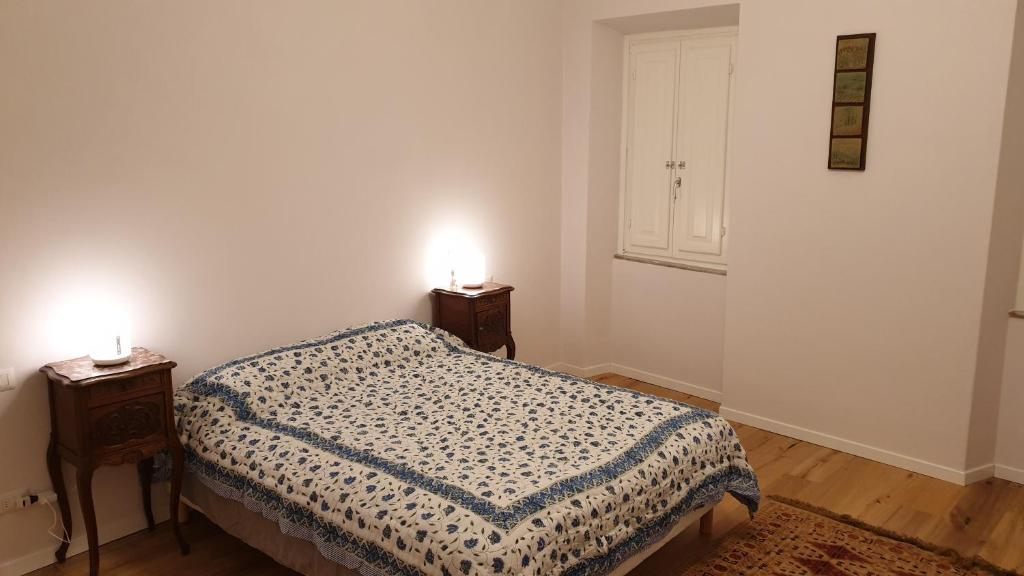 A bed or beds in a room at The SPIRIT OF LUCCA with all comfortable amenities
