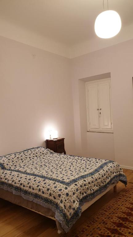 A bed or beds in a room at The SPIRIT OF LUCCA with all comfortable amenities