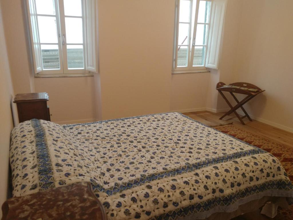 A bed or beds in a room at The SPIRIT OF LUCCA with all comfortable amenities