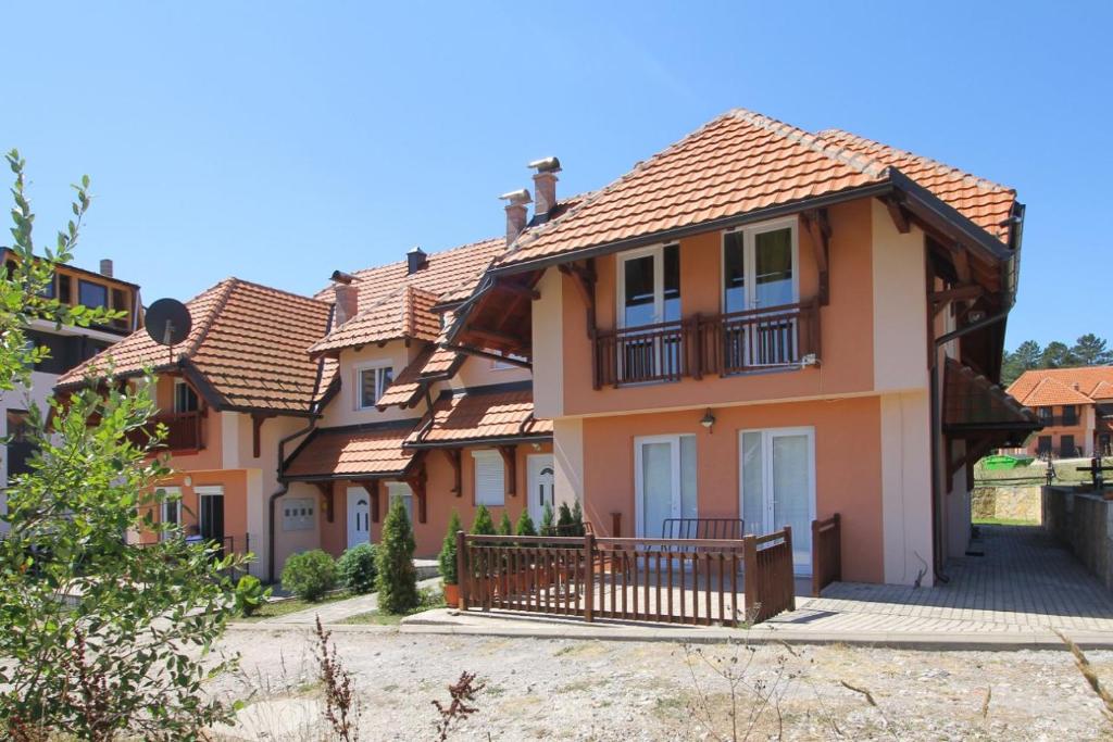 a large house with a tiled roof at Vila Mija in Zlatibor