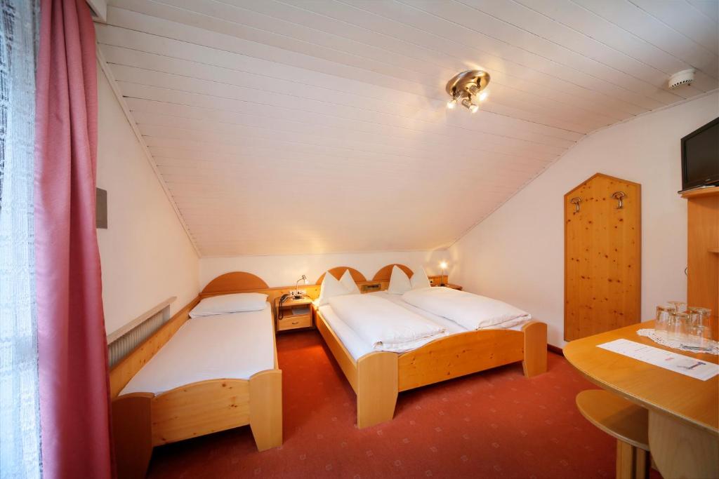 Postel nebo postele na pokoji v ubytování Hotel Unterrain