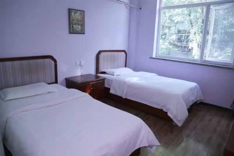 Postel nebo postele na pokoji v ubytování Xi'an The Facebook Youth Hostel