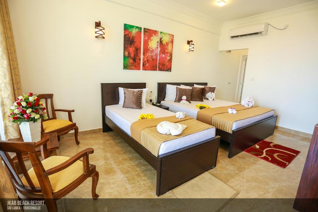 Postel nebo postele na pokoji v ubytování JKAB Beach Resort