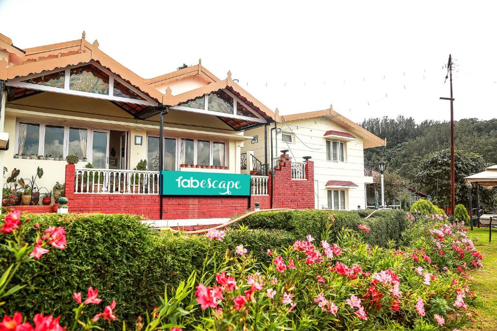 a house with a sign in front of it at FabEscape Saint Clouds in Ooty
