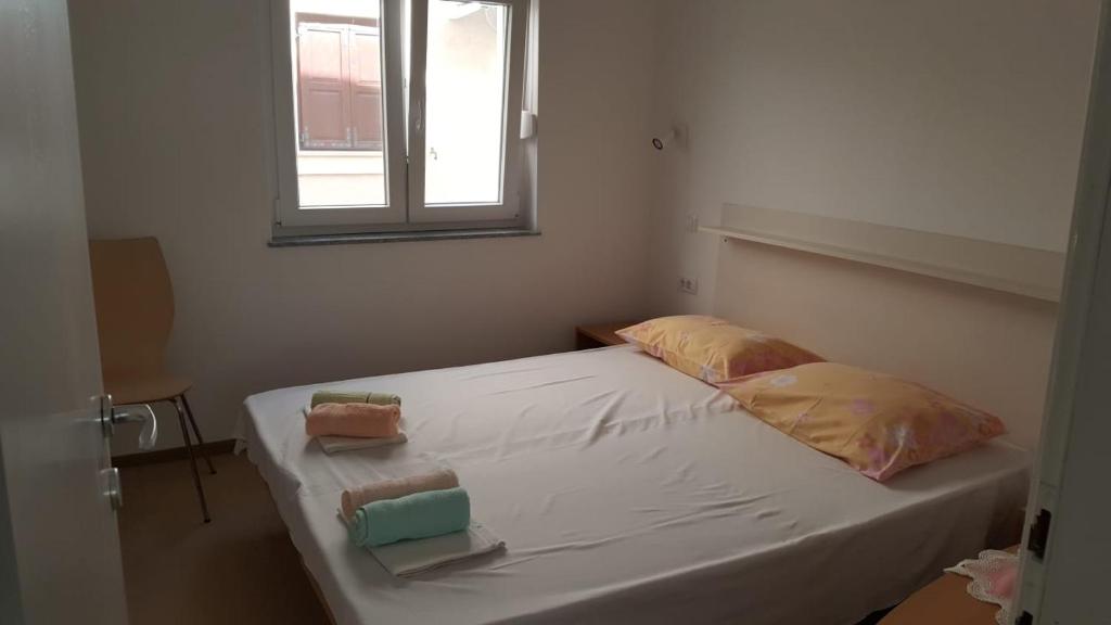 Postel nebo postele na pokoji v ubytování Holiday House Maretta - Apartment No 1