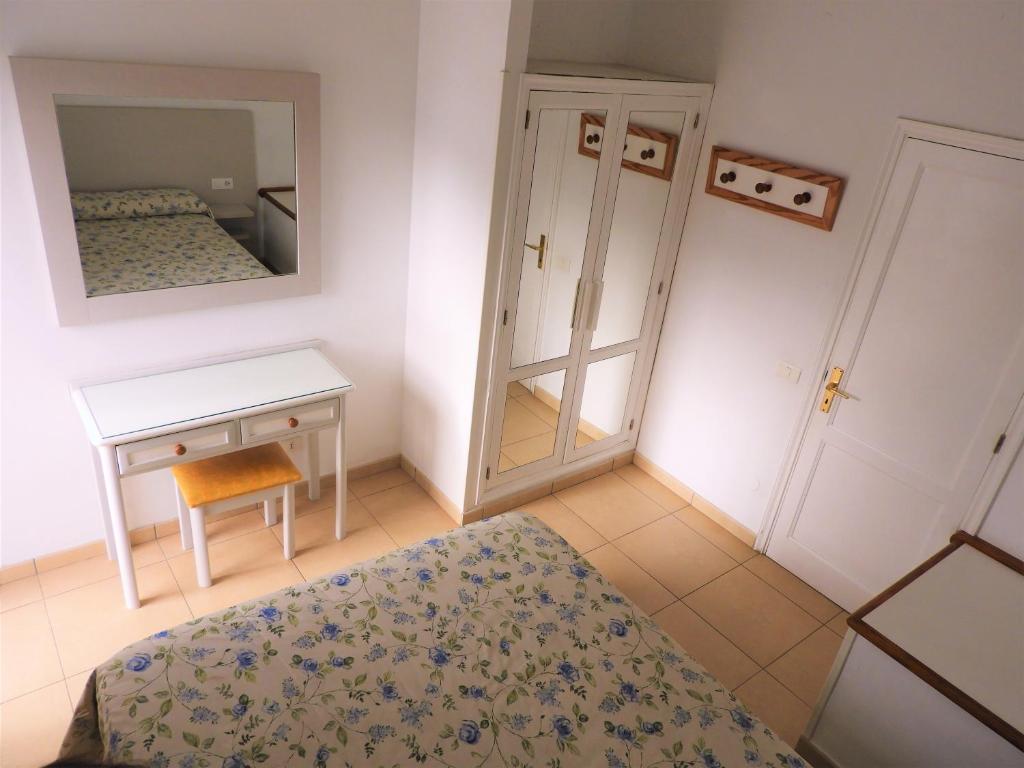 Postel nebo postele na pokoji v ubytování Bungalows Parque Nogal