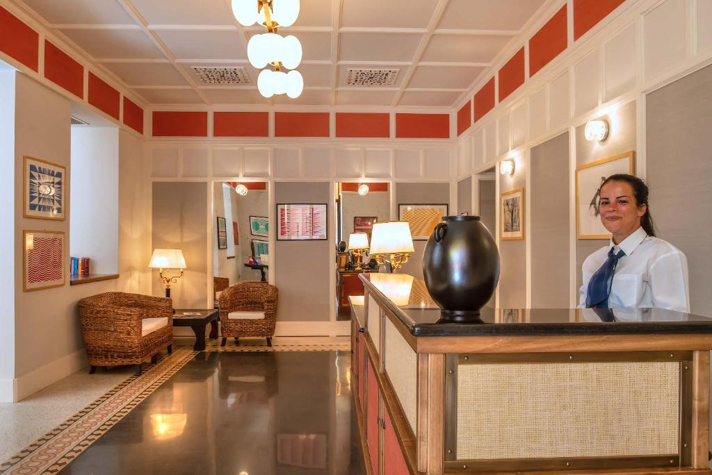 Os funcionários de Albergo Etico Roma