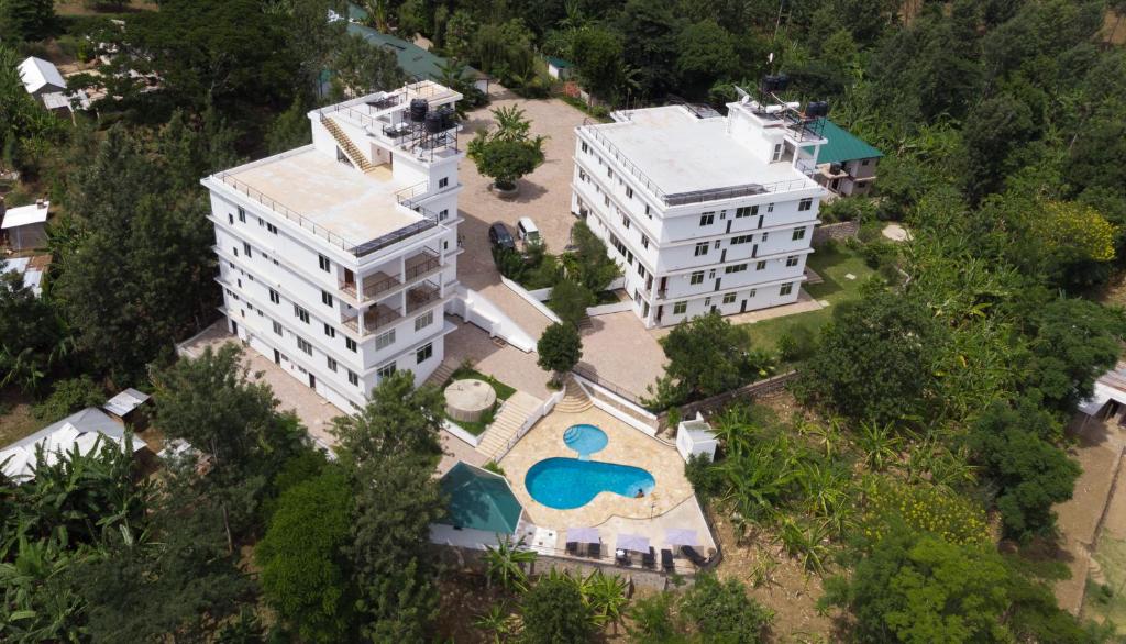 an aerial view of a building with a swimming pool at Two Mountains Lodge in Arusha