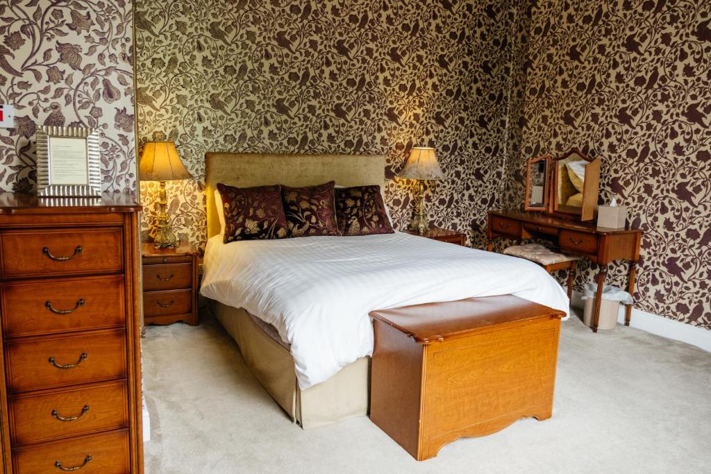 Postelja oz. postelje v sobi nastanitve The Stables Townhouse B&B