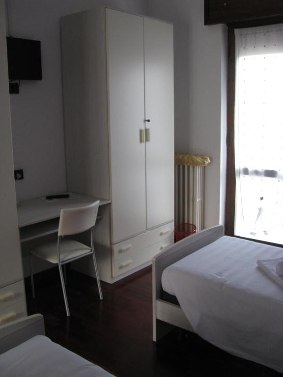 Postel nebo postele na pokoji v ubytování B&B Reginetta