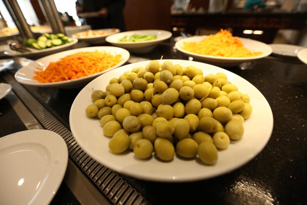 a plate of potatoes and carrots on a table at Tolip El Narges in Cairo