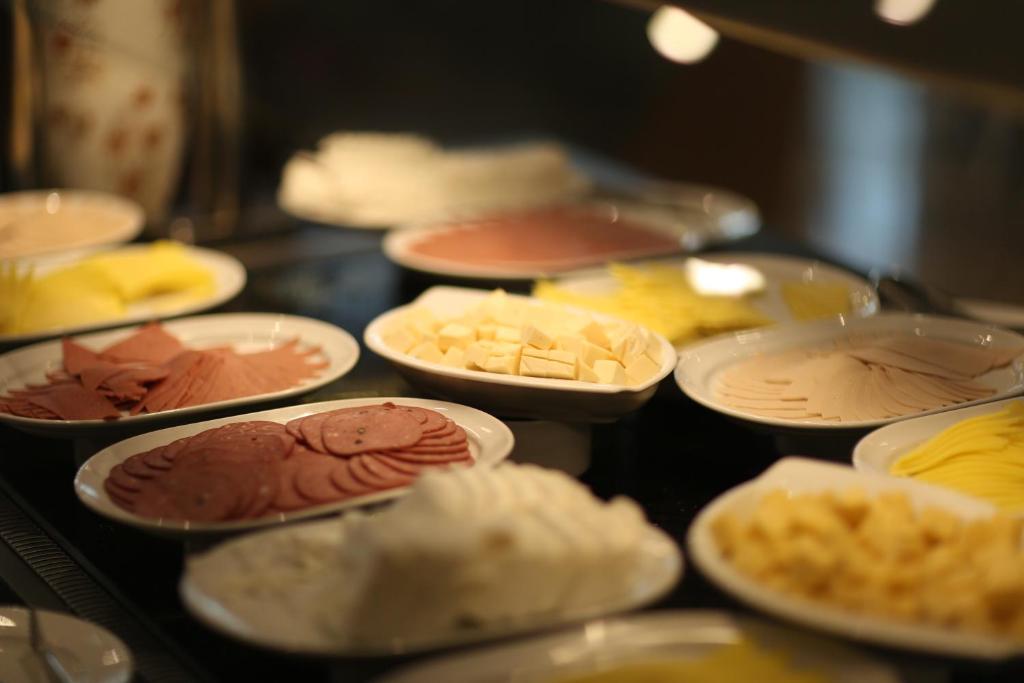 a bunch of different types of food on a table at Tolip El Narges in Cairo