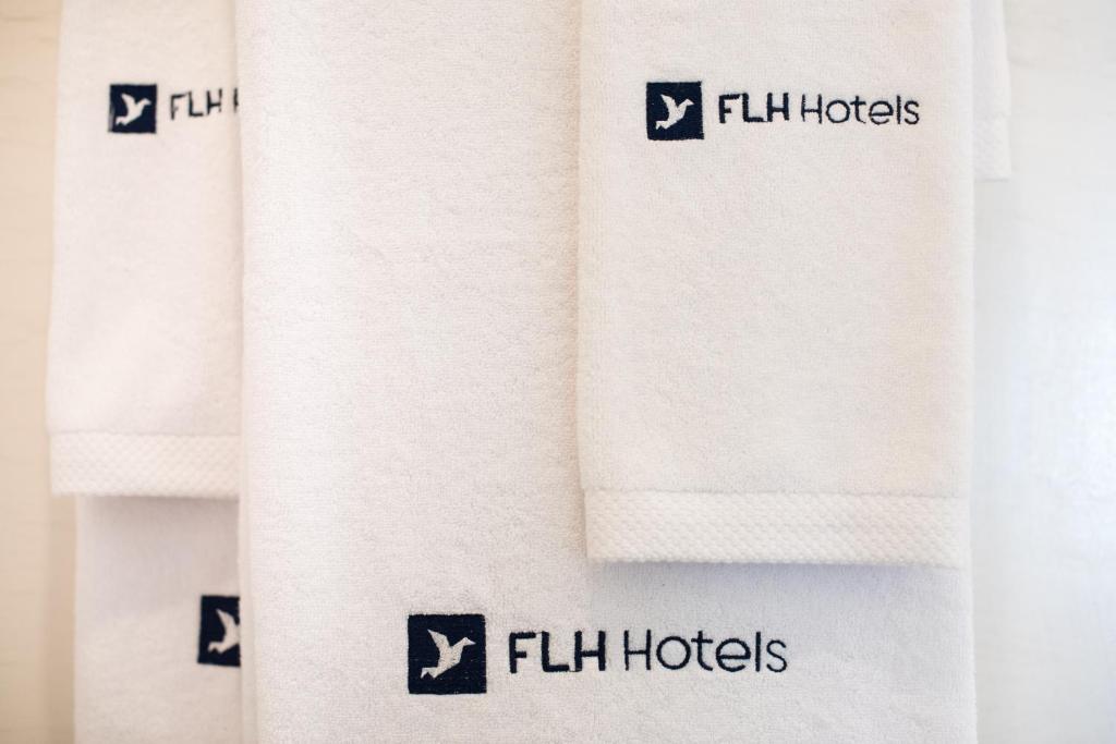 a close up of a towel with flilihudcks on it at Reserva FLH Hotels Ericeira in Ericeira