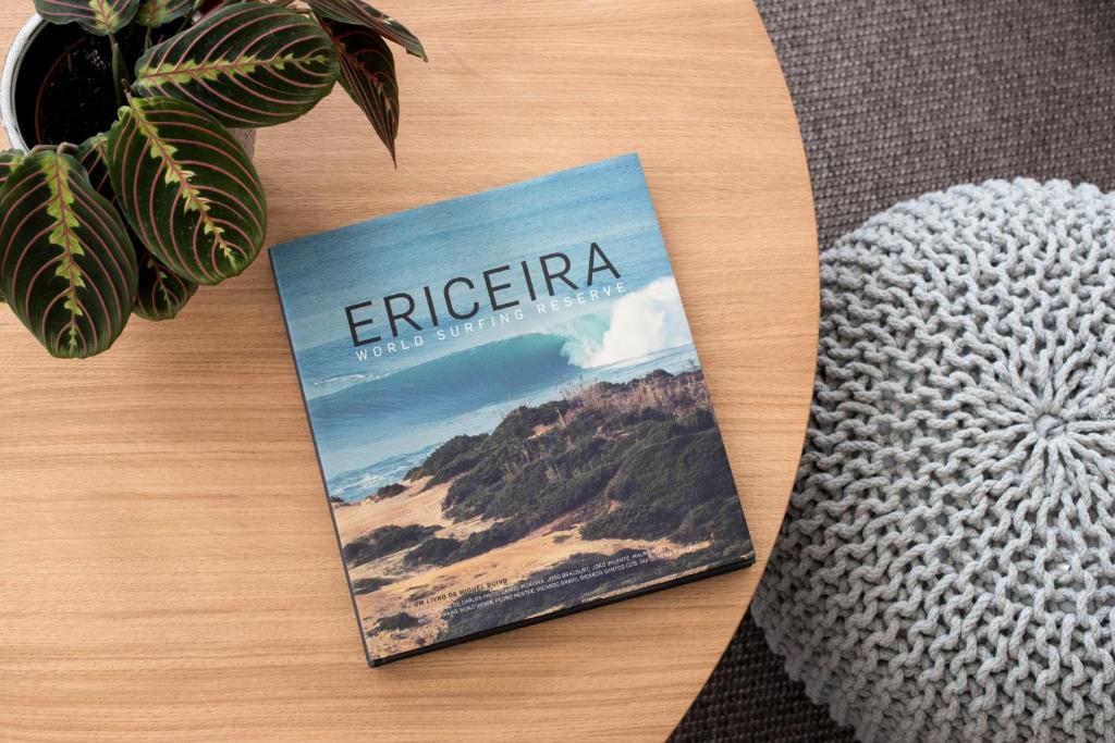 a book with the word erigerica sitting on a table at Reserva FLH Hotels Ericeira in Ericeira