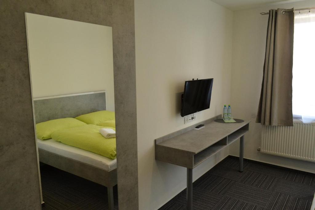 TV a/nebo společenská místnost v ubytování Garni Hotel 31