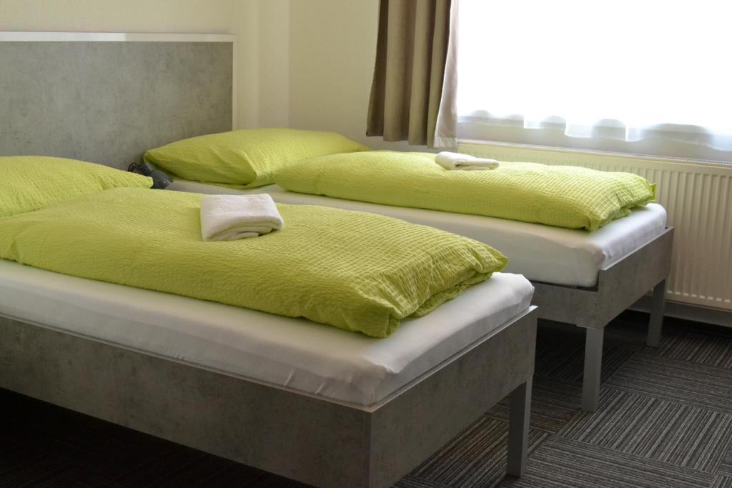 Postel nebo postele na pokoji v ubytování Garni Hotel 31