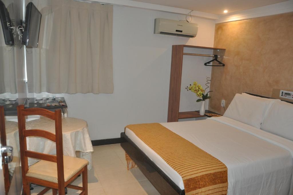 Postel nebo postele na pokoji v ubytování Hotel Sempre Bahia