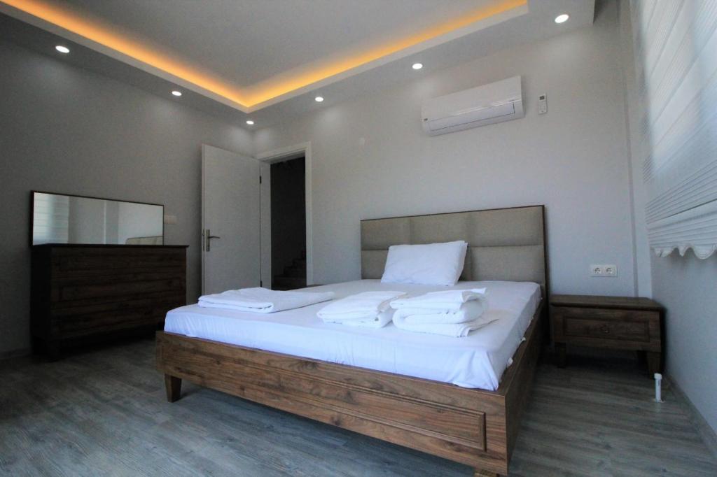 A bed or beds in a room at Private Villa in Gocek Villa Perest