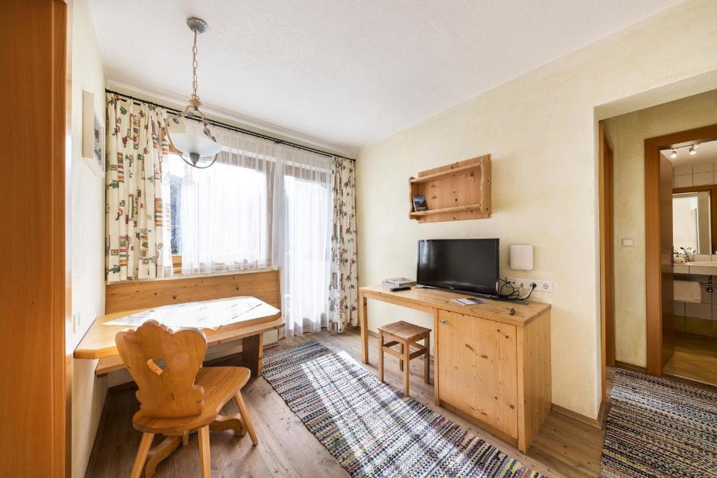 TV o dispositivi per l'intrattenimento presso Hotel Gasthof Stuibenfall