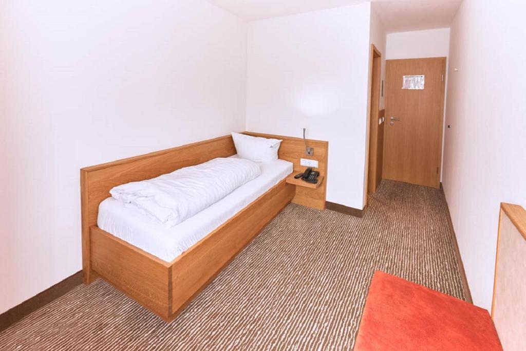 Postel nebo postele na pokoji v ubytování Gasthof-Hotel Pietsch