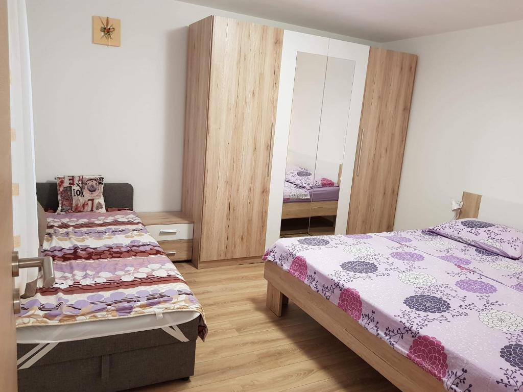 Ένα ή περισσότερα κρεβάτια σε δωμάτιο στο Apartment Natali