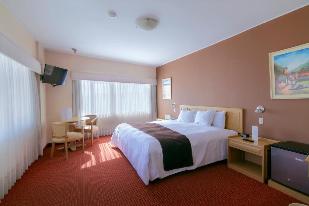 Postel nebo postele na pokoji v ubytování Hotel Jose Antonio Puno