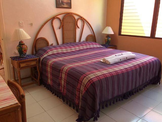 Postel nebo postele na pokoji v ubytování Hotel Maria's Nicte Ha