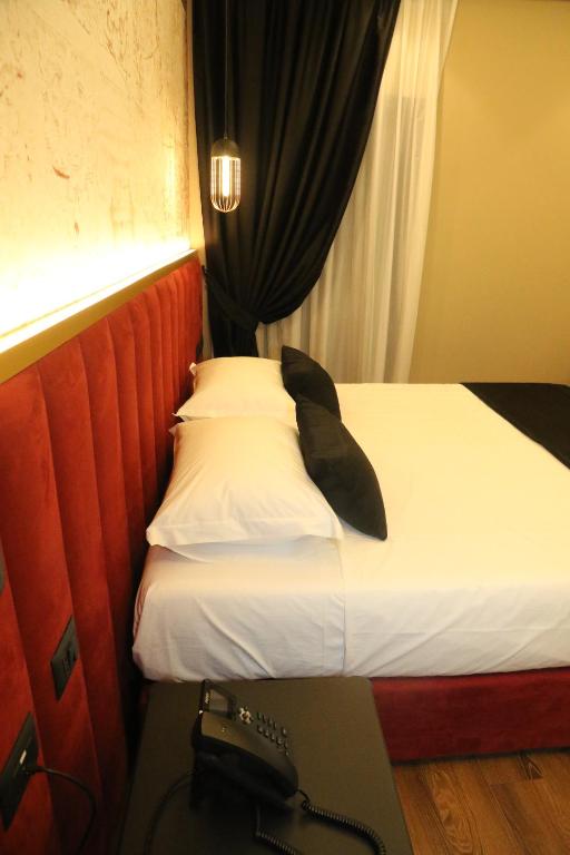 Postel nebo postele na pokoji v ubytování Hotel Kloest