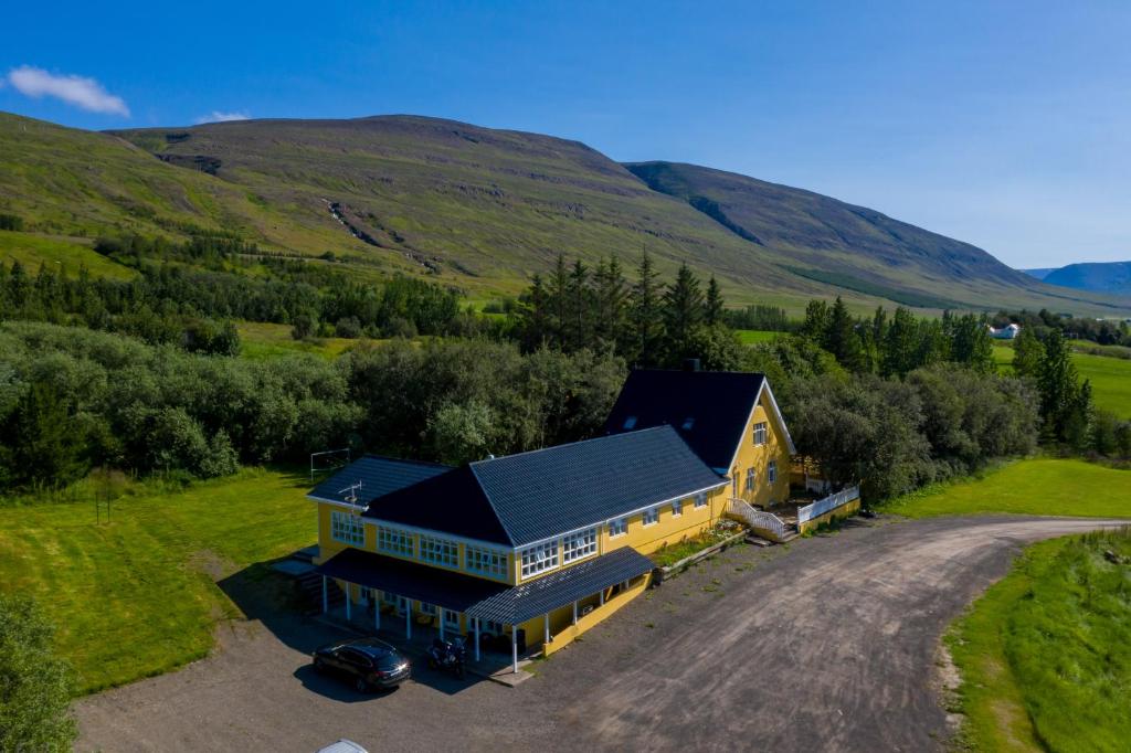 an aerial view of a house in the hills at Hotel North in Akureyri