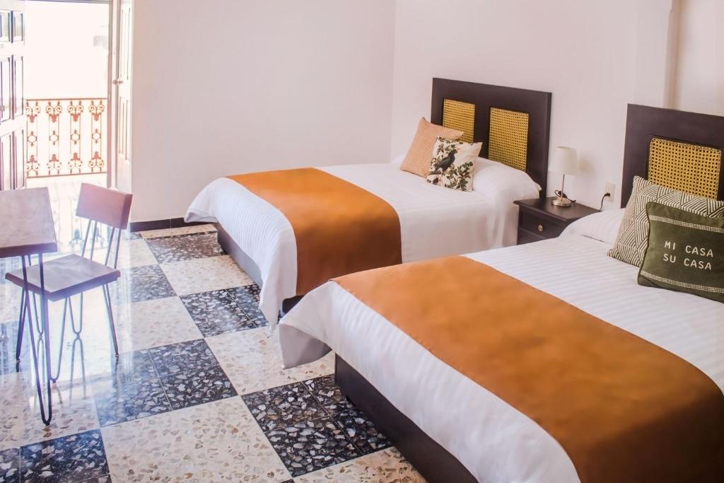 Postel nebo postele na pokoji v ubytování Múcara hotel
