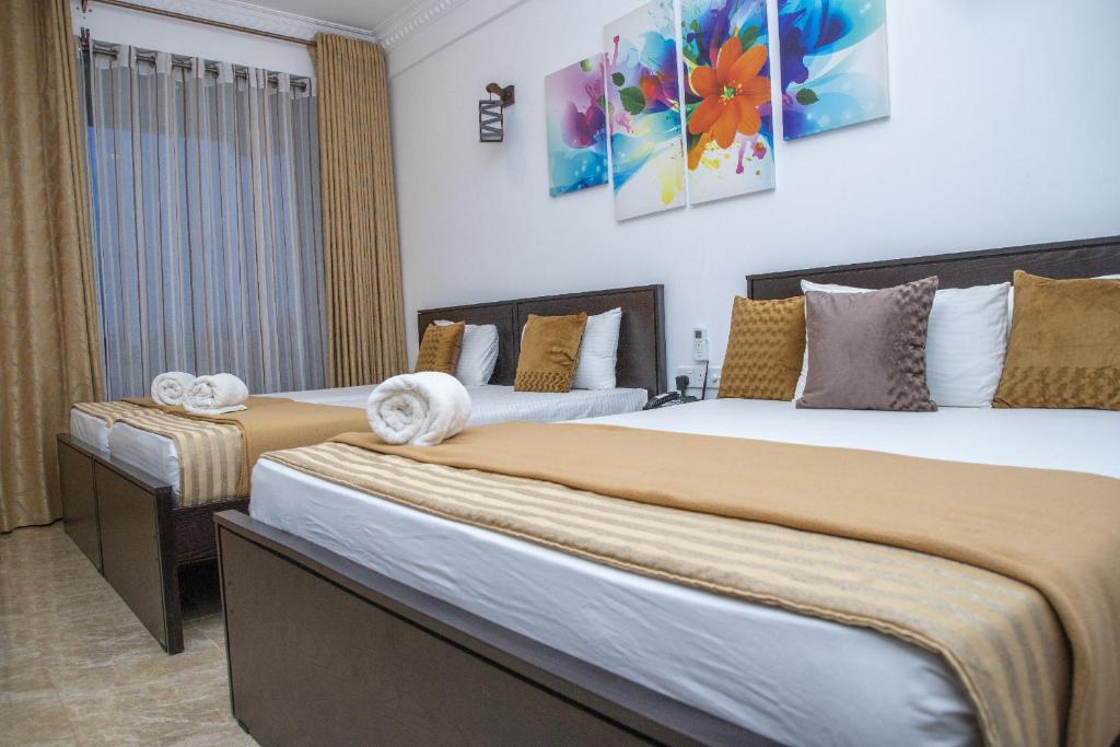 Postel nebo postele na pokoji v ubytování JKAB Beach Resort