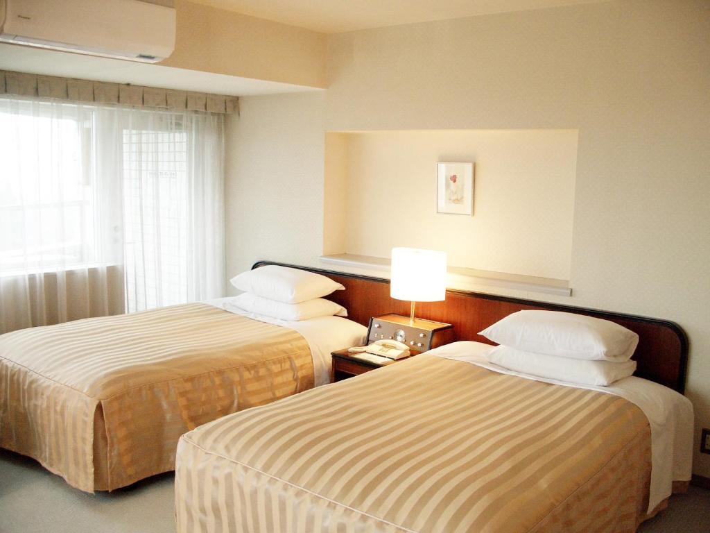 Postel nebo postele na pokoji v ubytování Hotel Heritage