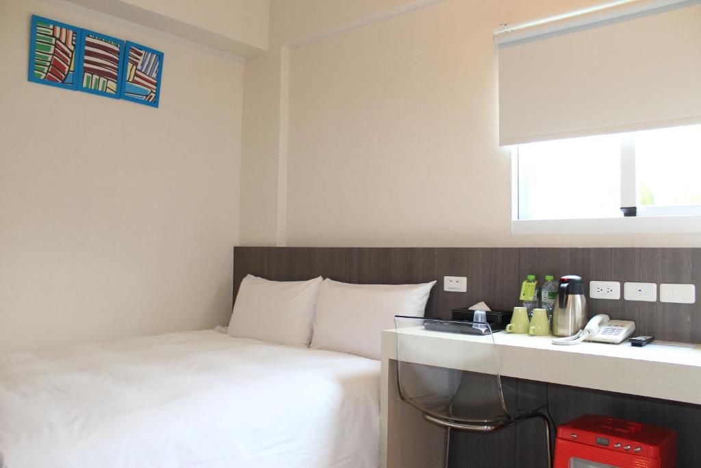 Postel nebo postele na pokoji v ubytování Sunnyside Hotel