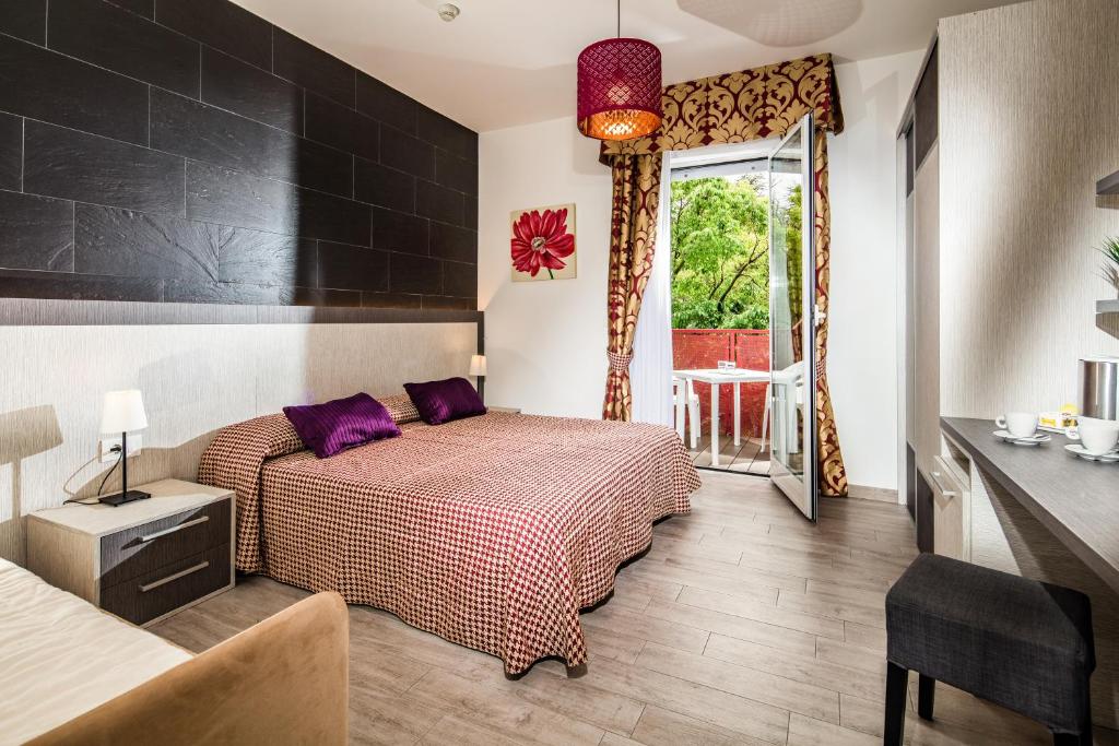 Postel nebo postele na pokoji v ubytování Hotel Vienna