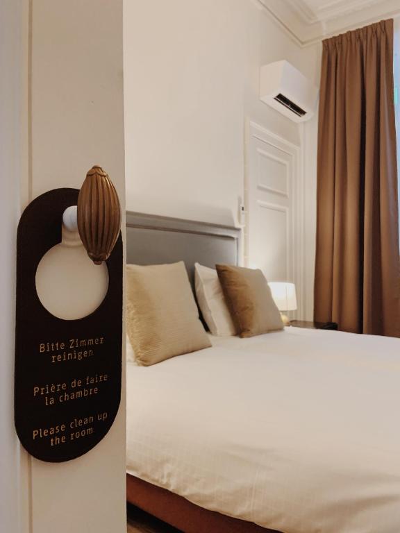 Postel nebo postele na pokoji v ubytování La Lys Rooms & Suites